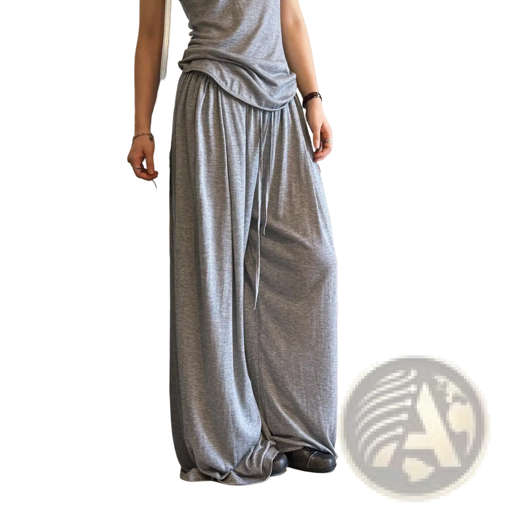 Loose-fitting gray wool blend wide leg pants with a soft flowing fabric texture and drawstring waist