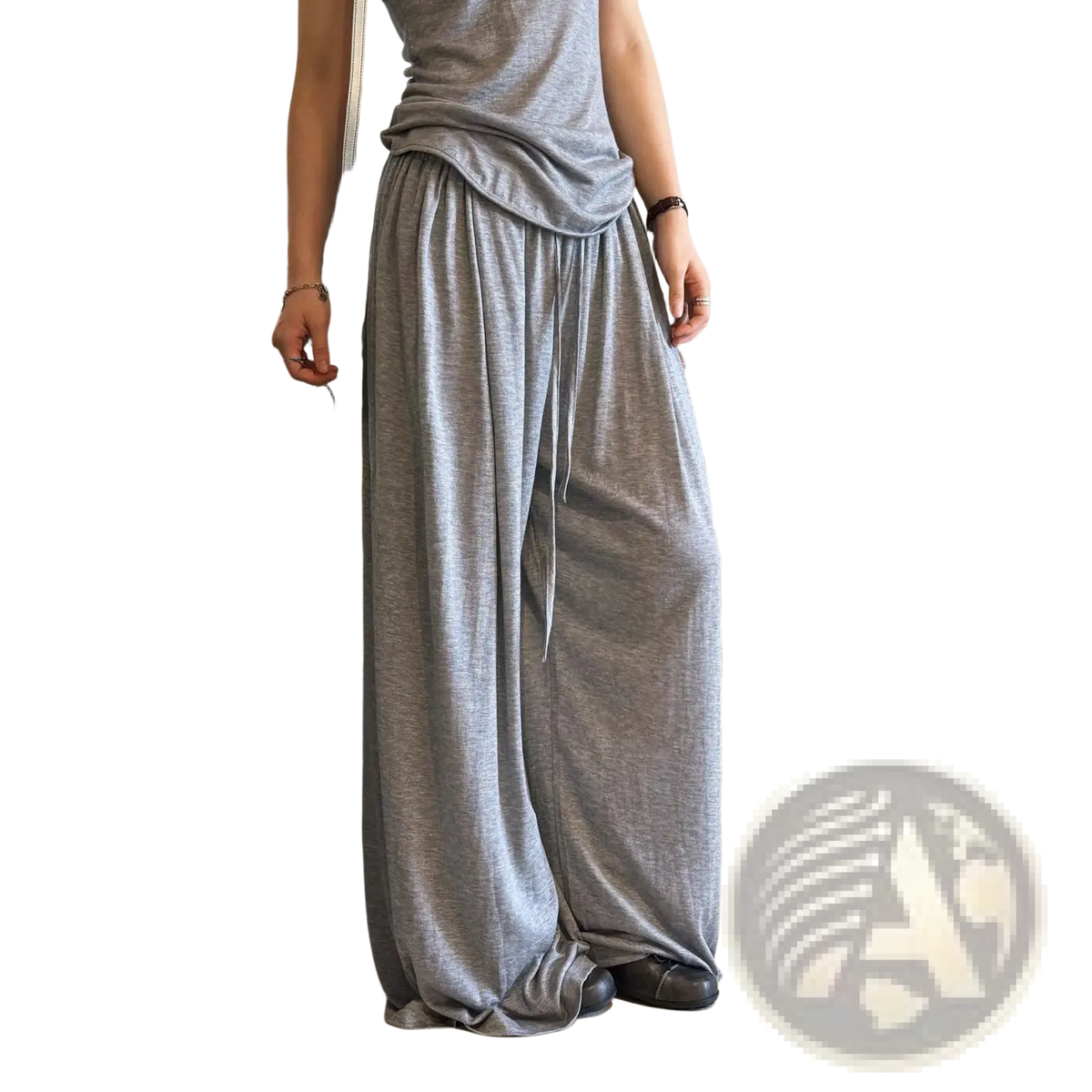 Loose-fitting gray wool blend wide leg pants with a soft flowing fabric texture and drawstring waist