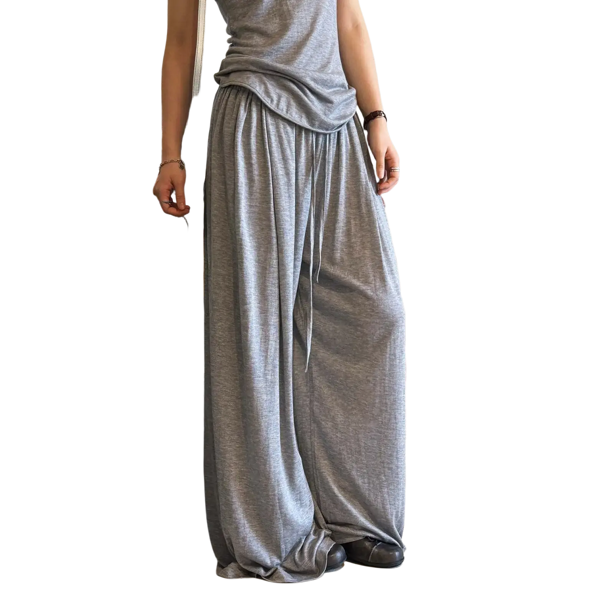 Loose-fitting gray wool blend wide leg pants with a soft flowing fabric texture and drawstring waist
