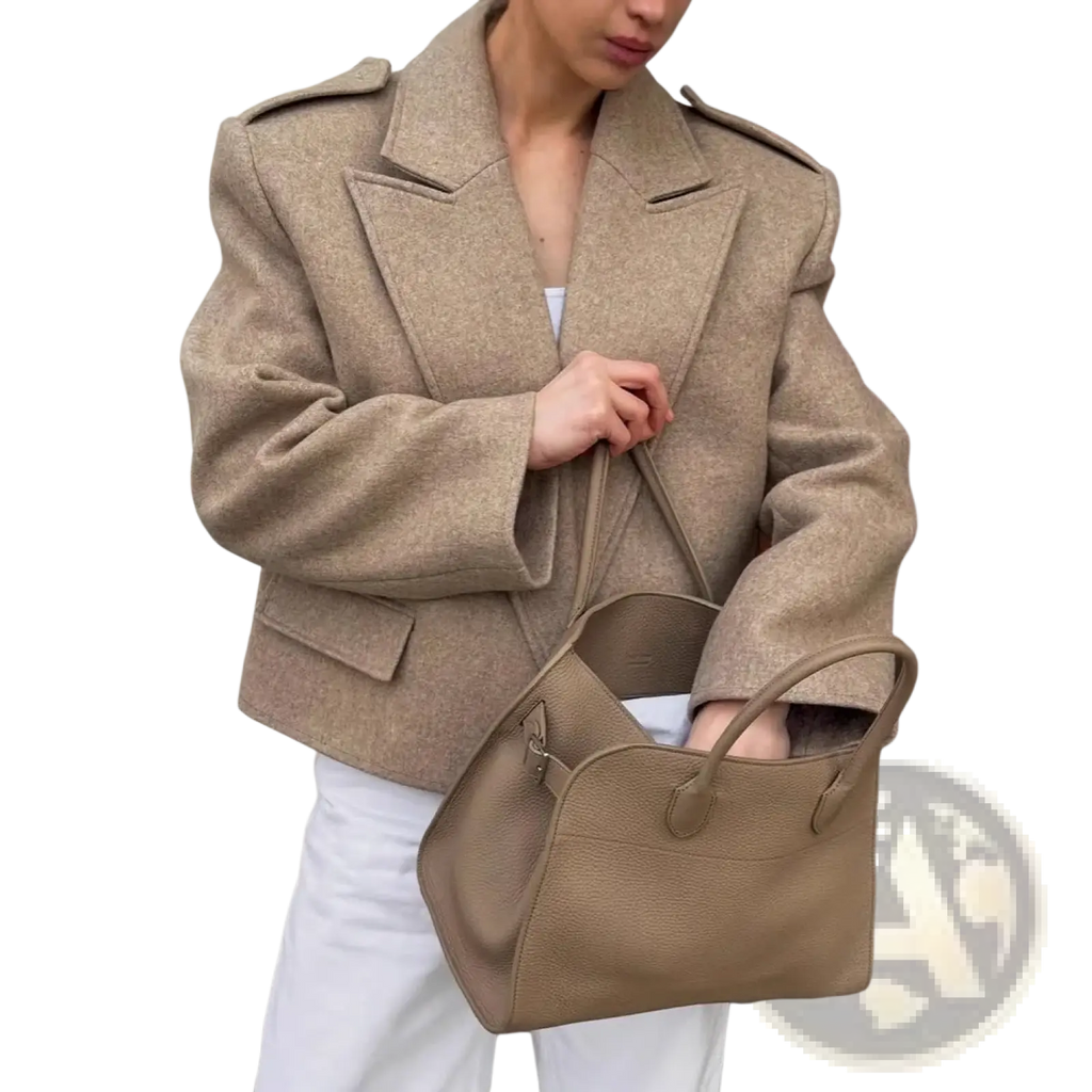Beige wool blend winter coat with textured fabric structured shoulders and flap pockets for cold weather use