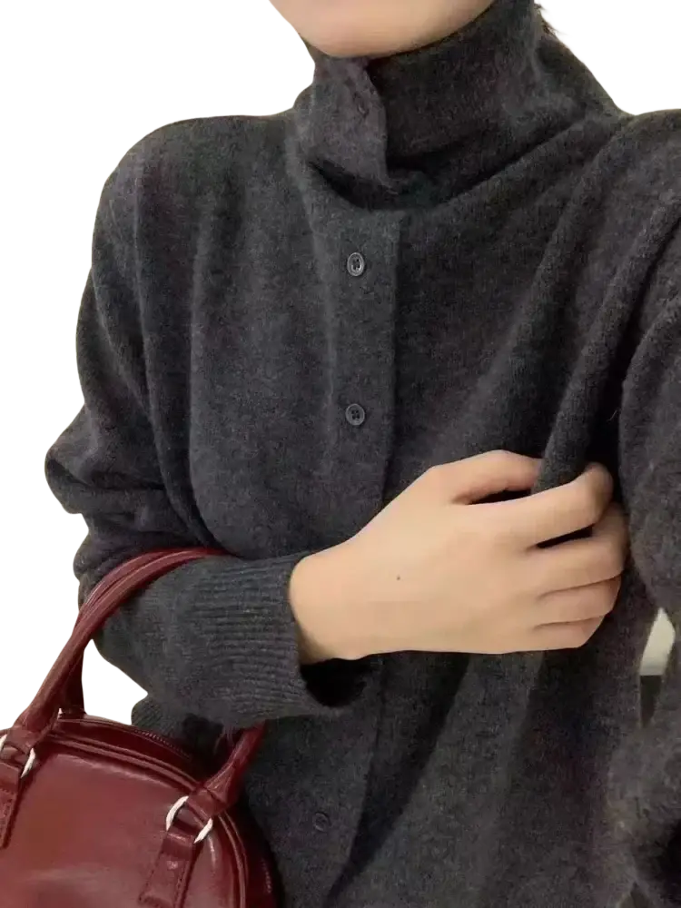 Dark gray wool button turtleneck sweater with soft knit texture and three matching buttons down the front