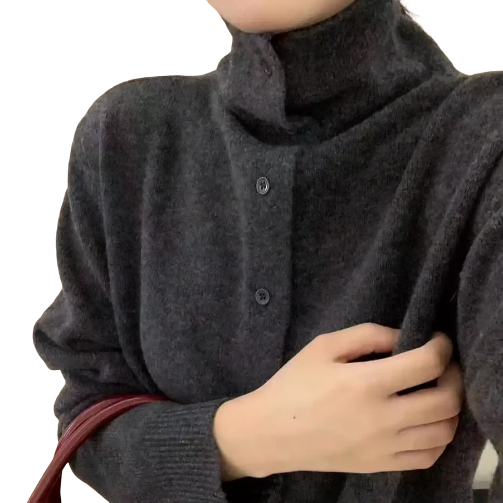 Dark gray wool button turtleneck sweater with subtle texture and matching buttons for stylish warmth