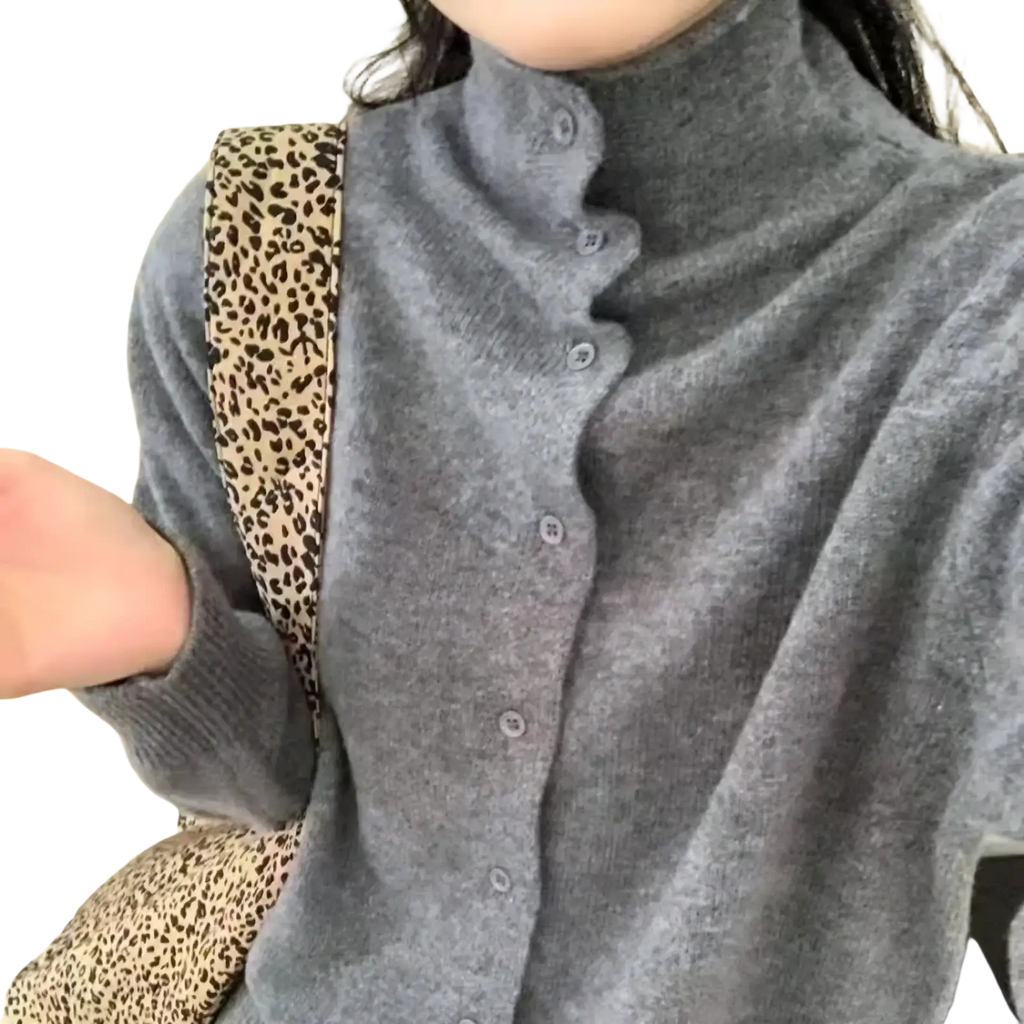 Gray wool high-neck knit sweater with button closure ideal for warm and stylish winter wear