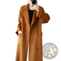 A warm camel-colored wool cashmere belted long overcoat with double-breasted design and large patch pockets