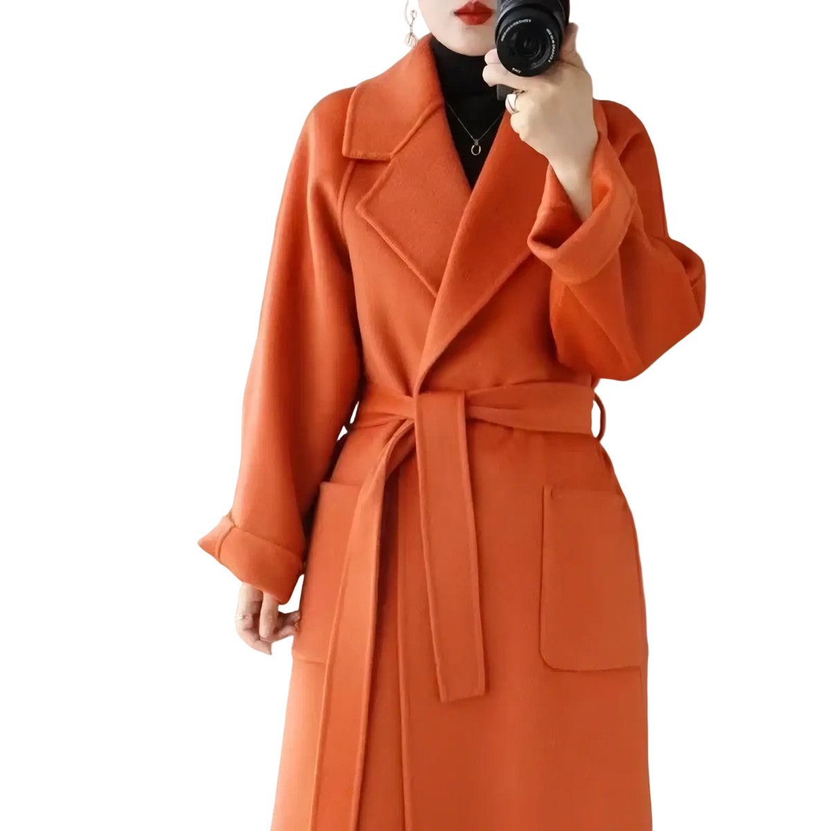 A vibrant orange wool cashmere long overcoat with a belted waist and large patch pockets