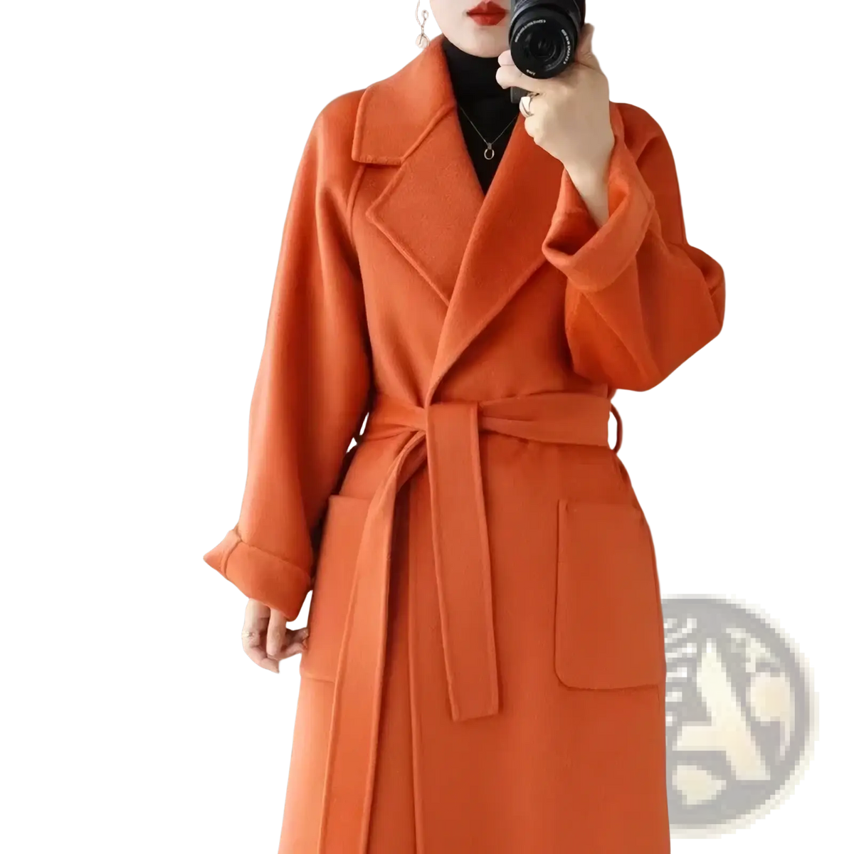 A vibrant orange wool cashmere long overcoat with a belted waist and large patch pockets