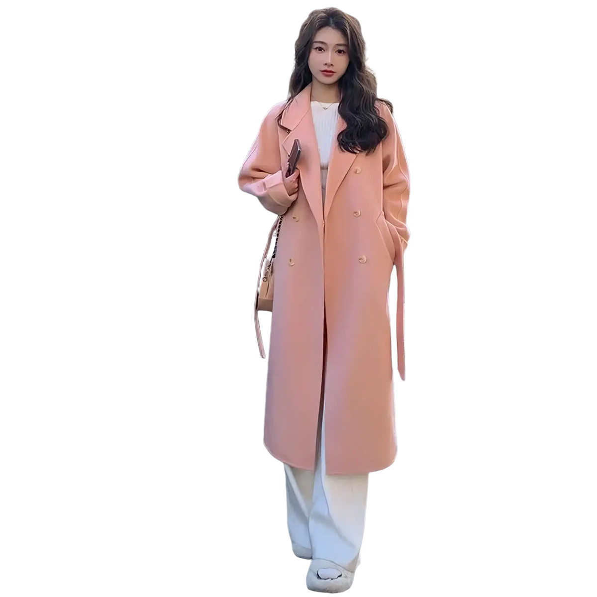 A soft peach-colored wool cashmere double-breasted belted overcoat for women with a classic collar and buttoned front