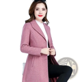 A stylish pink herringbone wool coat for women with double-breasted design and notched lapels for winter wear
