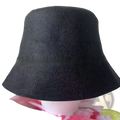 A sleek black wool felt sauna cap bucket hat with a soft textured surface and a wide brim