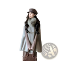 Brown leather handbag with top handles and structured design complementing wool fur collar cape coat