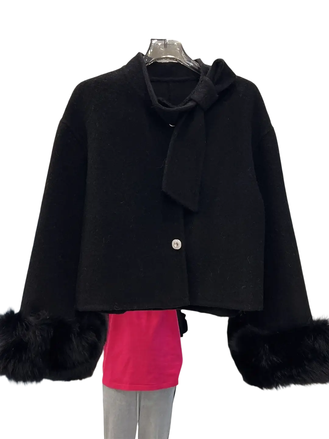 Black wool cropped coat with faux fur cuffs and bow detail at the neckline for stylish cold weather wear