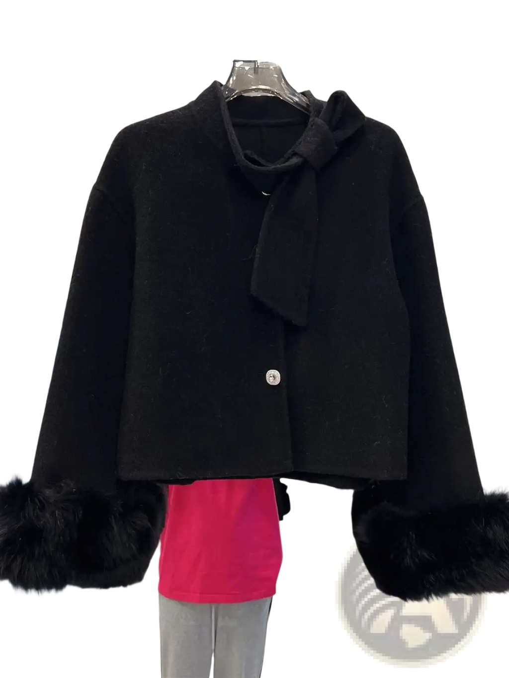 Black wool cropped coat with faux fur cuffs and bow detail at the neckline for stylish cold weather wear