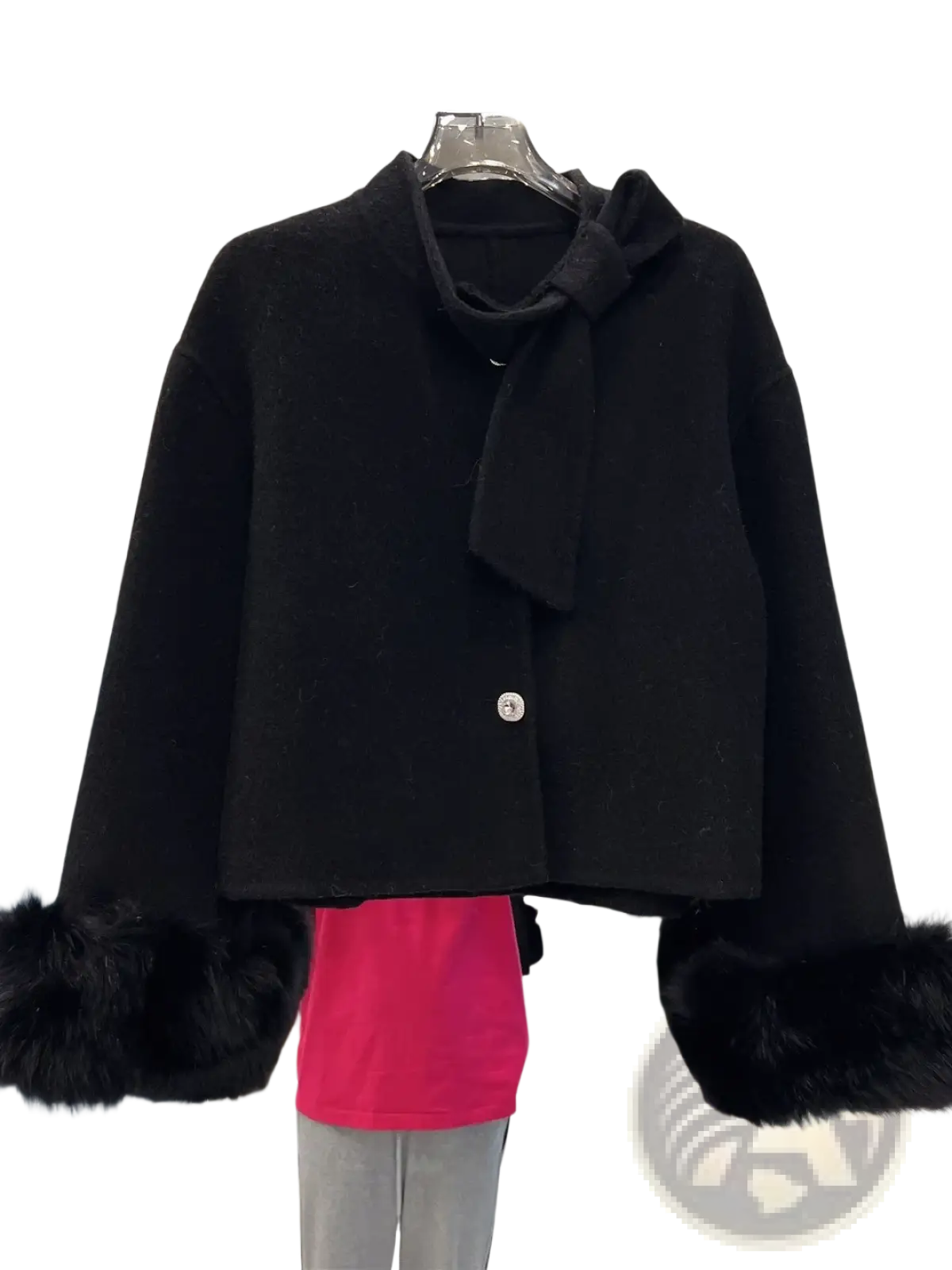 Black wool cropped coat with faux fur cuffs and bow detail at the neckline for stylish cold weather wear