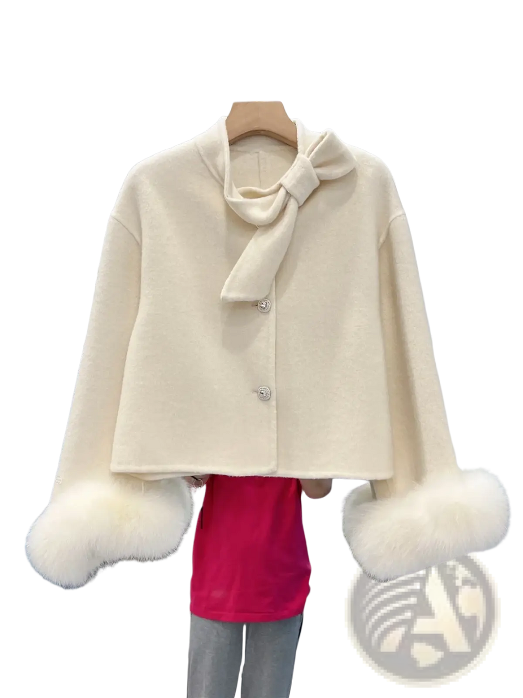 Cream-colored wool cropped coat with fluffy white fur cuffs and matching bow at the neckline