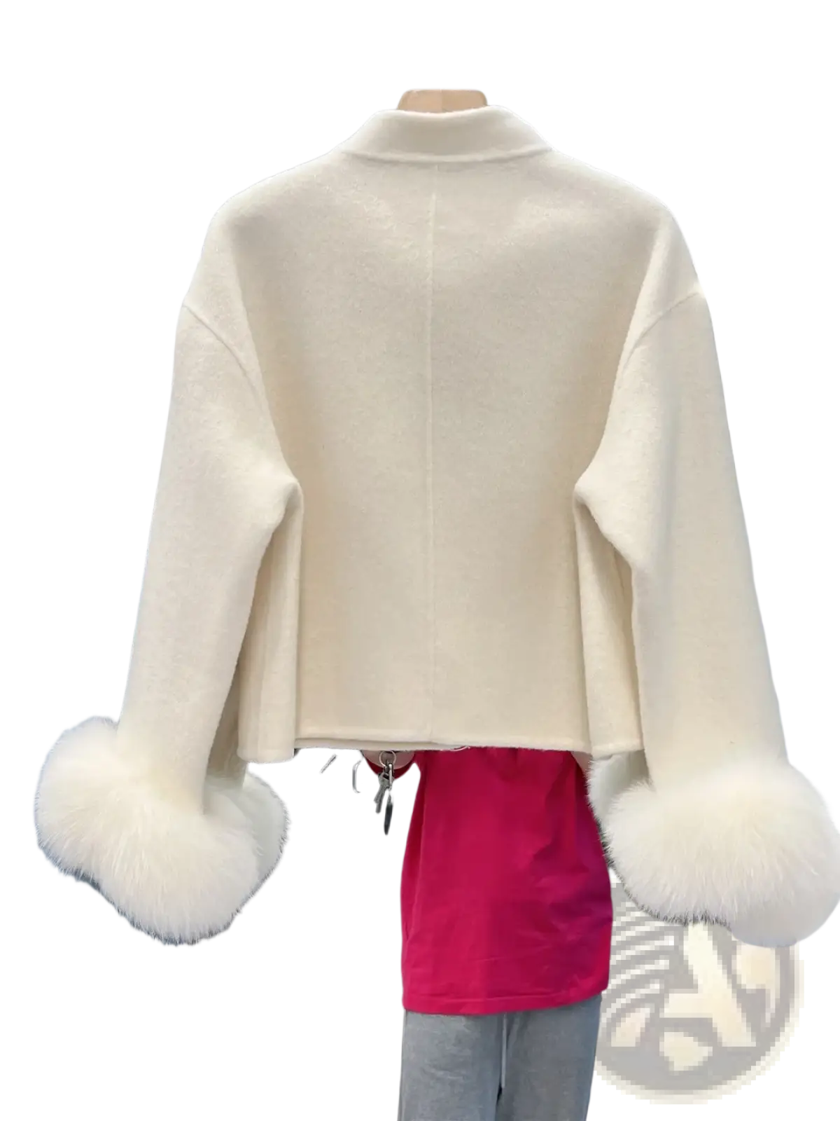 Cream-colored wool cropped coat with fluffy white fur cuffs and bow detail for stylish winter wear
