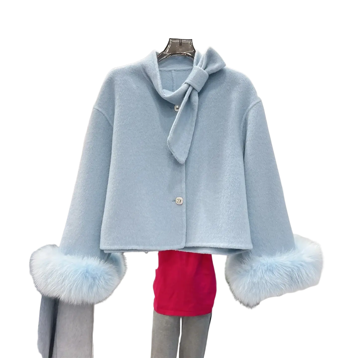 Light blue wool cropped coat with fluffy fur cuffs and matching bow at neckline for stylish cold weather wear