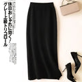 Black wool knit midi skirt with a high waisted, sleek, form fitting pencil silhouette