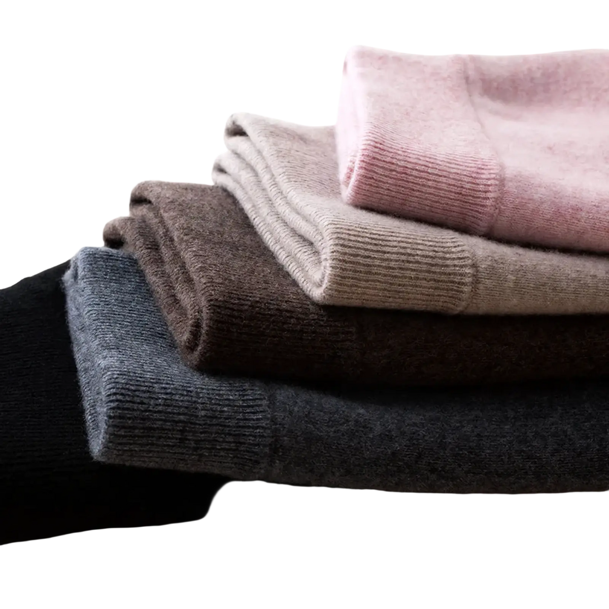 Stack of soft knit women’s shirts in dusty rose beige charcoal gray and black displayed with wool knit midi skirt