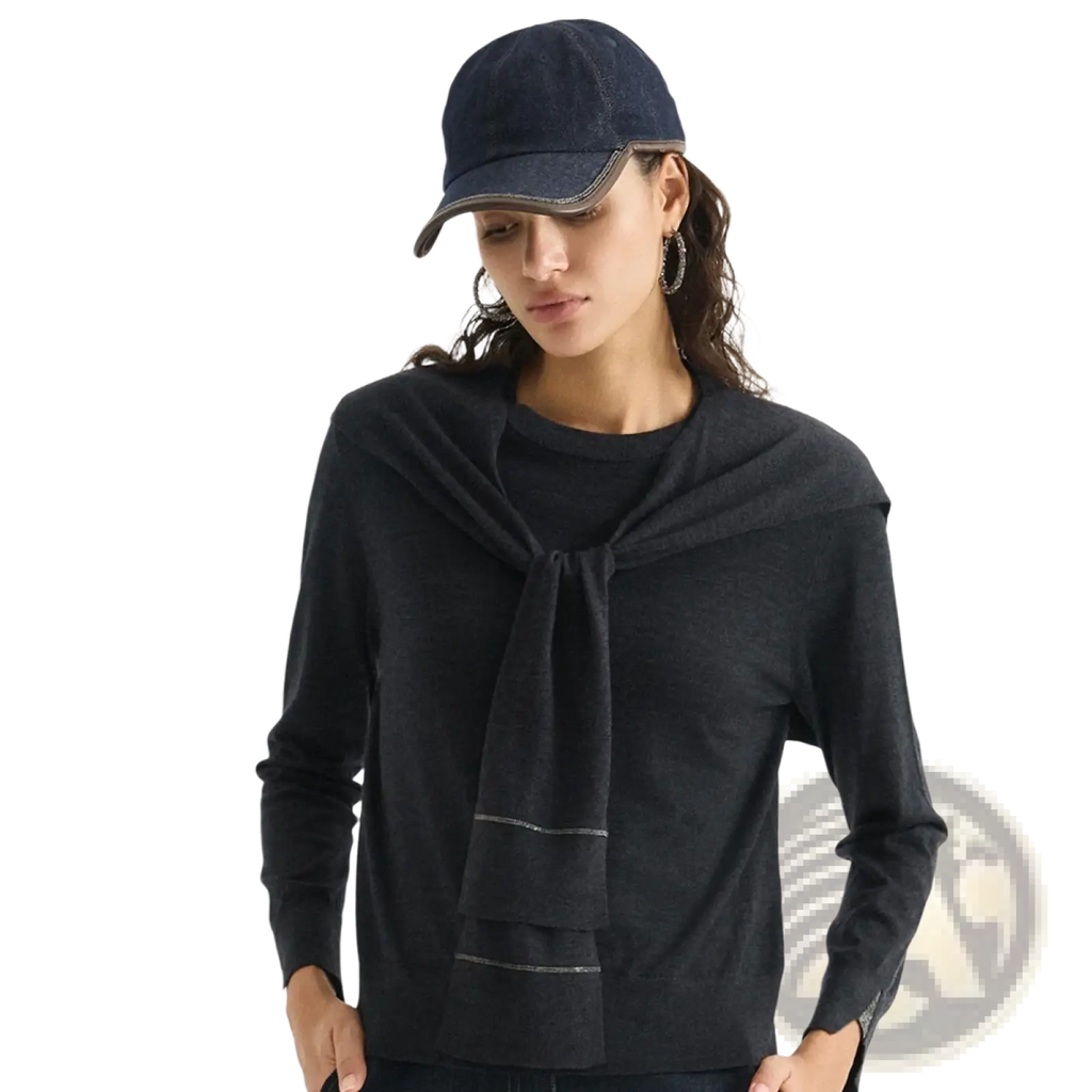 Dark blue denim baseball cap with stitched brim and subtle contrast stitching paired with wool knit shoulder wrap cape scarf