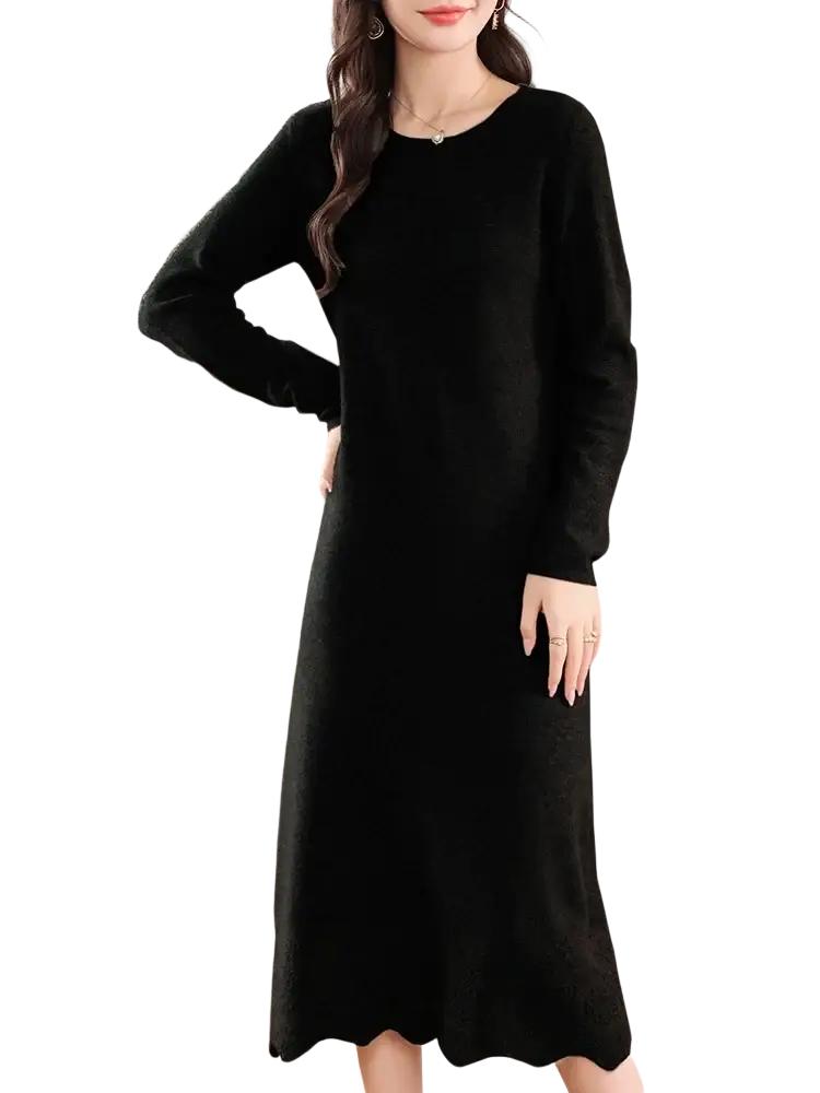 Black wool knit sweater dress with long sleeves, scalloped hem, and round neckline suitable for cold weather