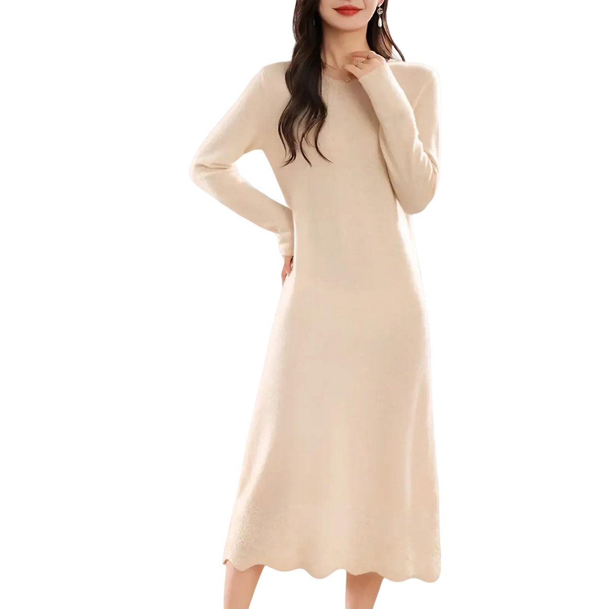A cream-colored wool knit sweater dress with long sleeves, round neckline, and scalloped hem midi length
