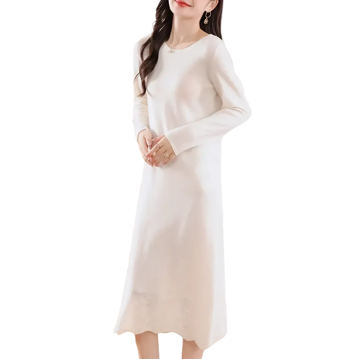 A soft off-white wool knit sweater dress with long sleeves round neckline and scalloped midi hem