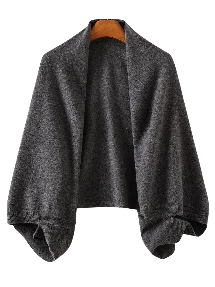 A soft dark gray knitted wool shawl wrap scarf with a loose draped silhouette and ribbed cuffs for women