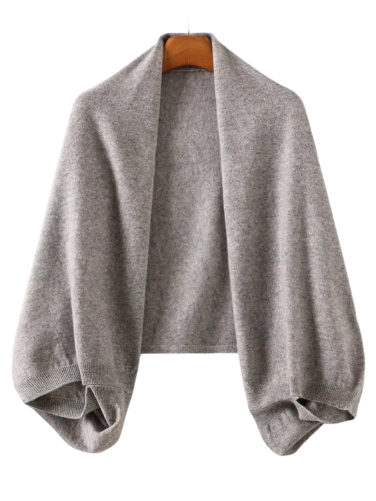A soft heather gray wool shawl wrap scarf for women with relaxed fit and ribbed cuffs in knit material
