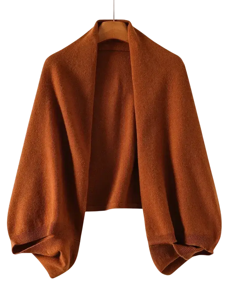A soft rust-colored wool knit shawl wrap scarf for women featuring a wide collar and long sleeves
