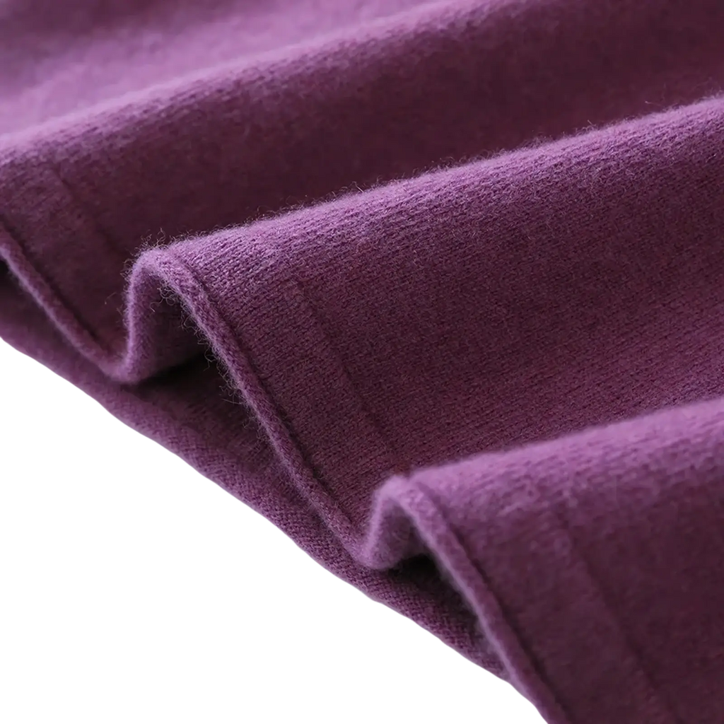 Soft deep purple wool turtleneck midi dress with smooth texture and subtle ribbed knit pattern