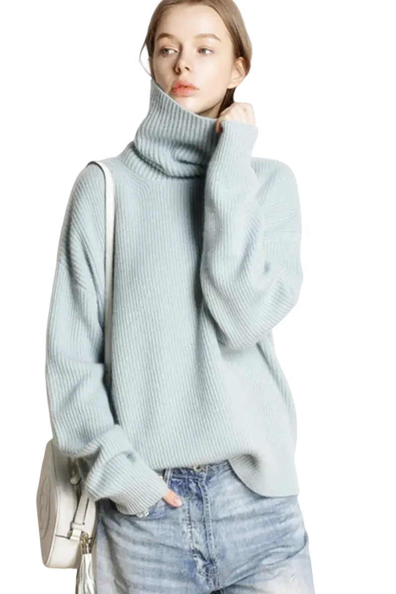 A soft light blue wool oversized ribbed knit pullover turtleneck sweater for comfortable casual wear