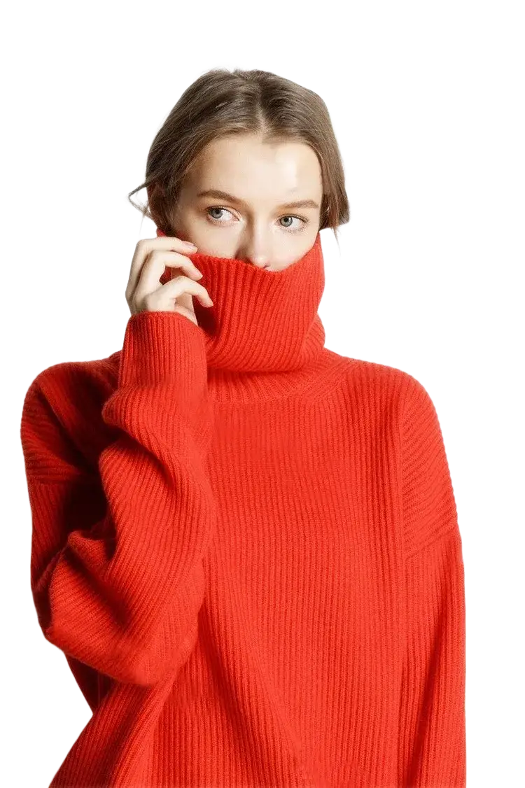 A vibrant red wool turtleneck sweater with a cozy oversized ribbed knit pullover fit