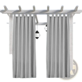 Light gray woolen outdoor blackout curtains with vertical pleats hanging from a white wooden pergola with straps