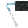 Wooting keyboard ribbon custom strap featuring light blue satin ribbon with silver dragon charm and white tassel attached