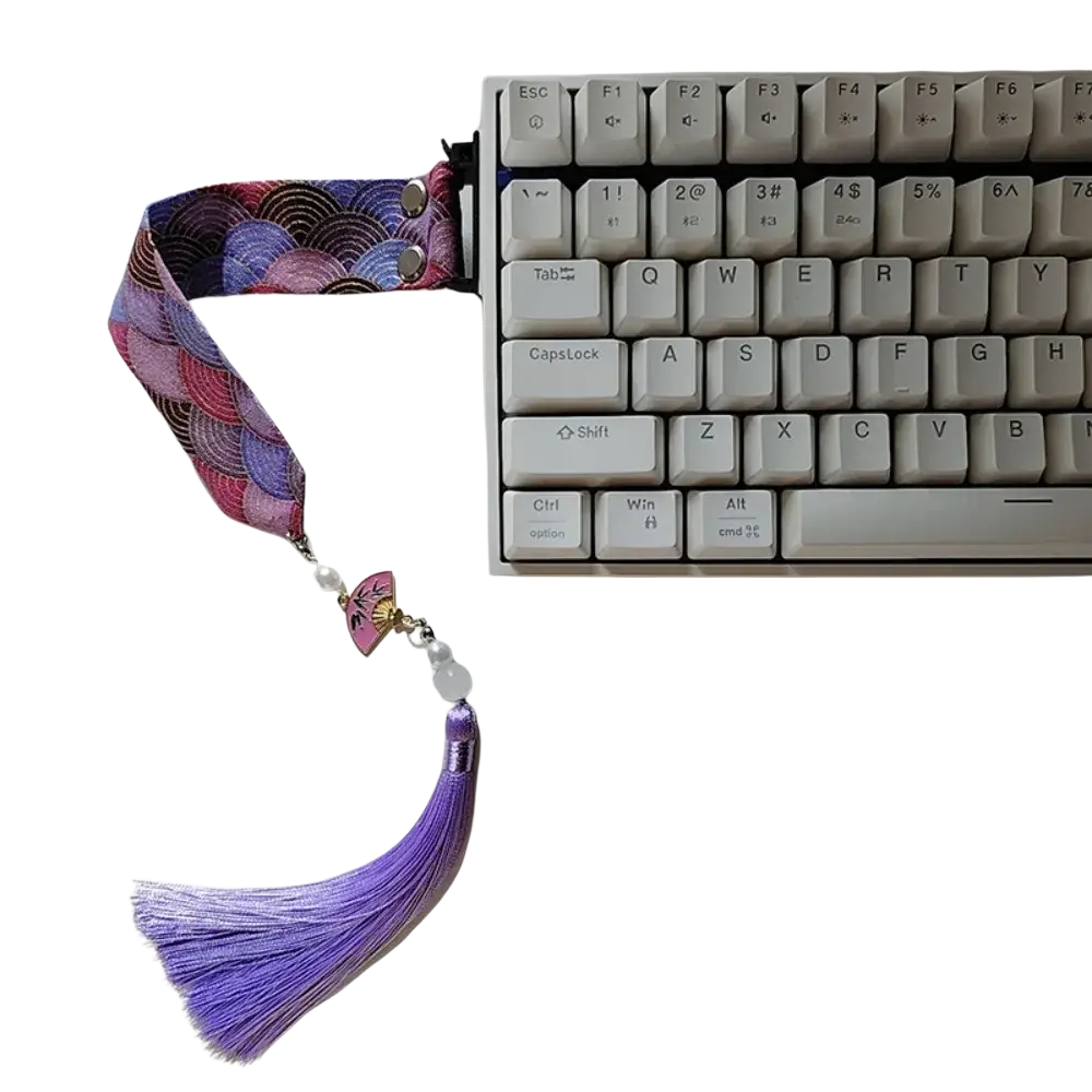 Wooting keyboard ribbon dragon design custom strap made of purple and pink patterned fabric with tassel and pearl beads