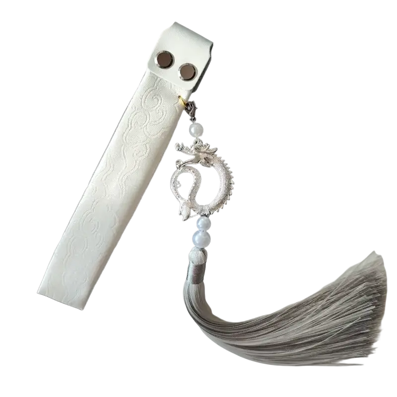 White leather bookmark with silver dragon charm and gray tassel from Wooting keyboard ribbon dragon design strap