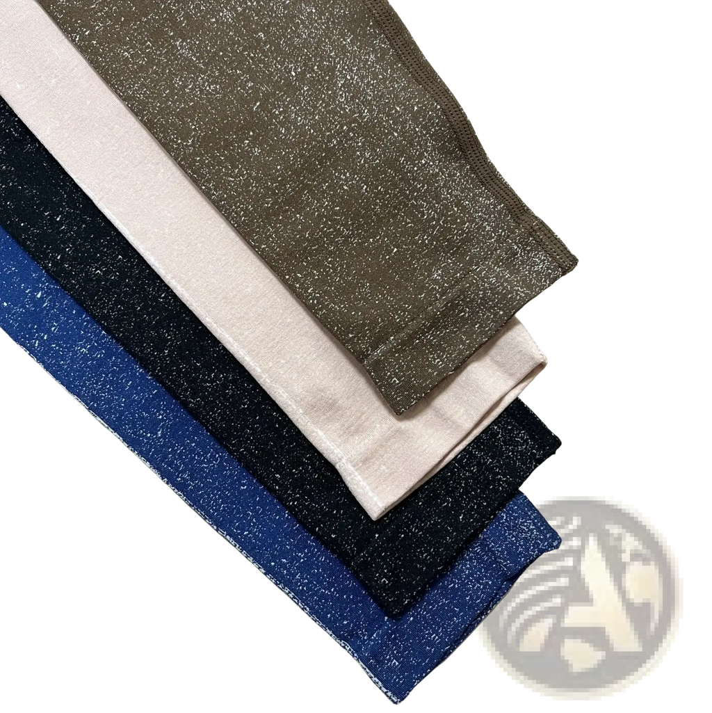 A stack of high waisted booty lifting workout leggings in taupe blush pink navy and royal blue with glittery texture