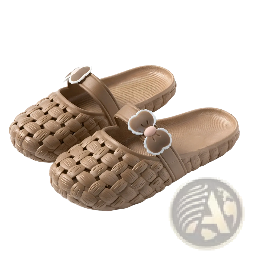 Beige woven pvc slide sandals with a bow decoration on the strap ideal for summer beach wear
