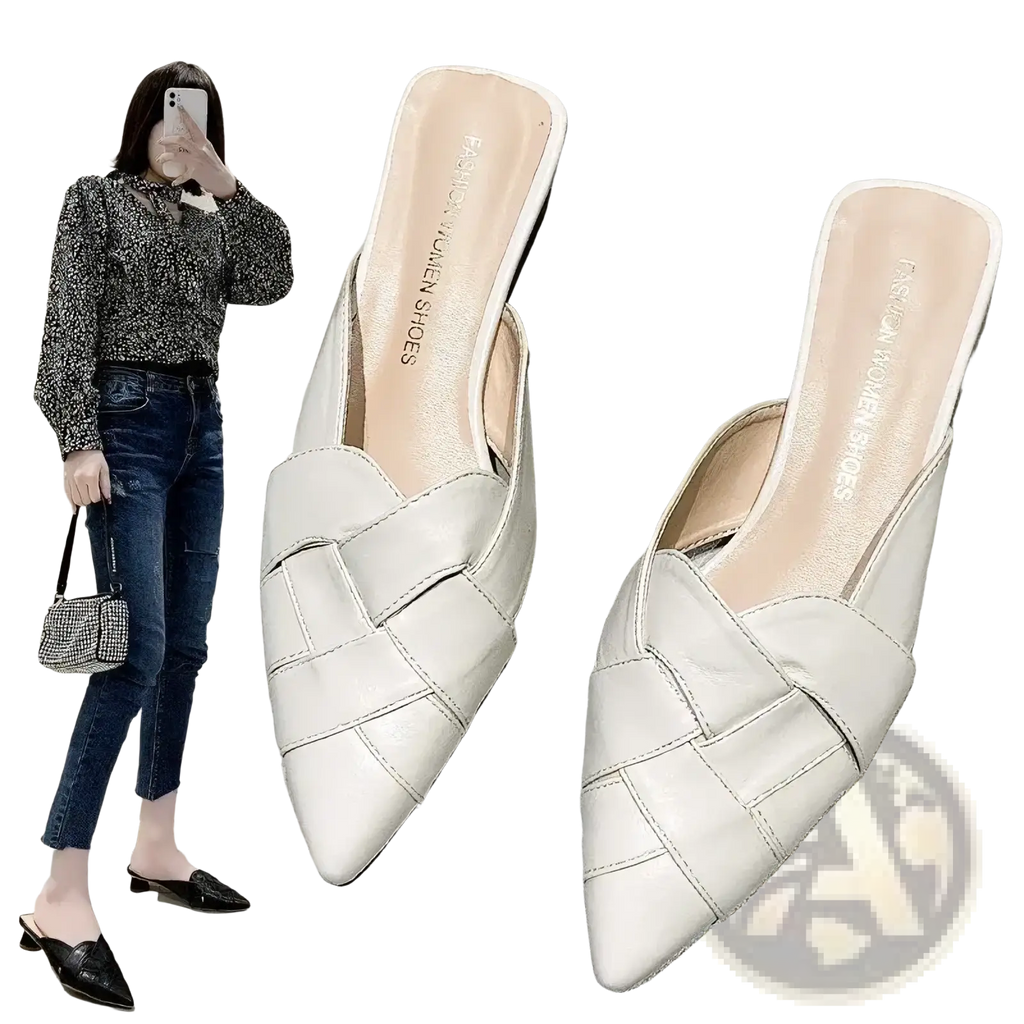 White leather pointed toe mules featuring a woven strap design for elegant and stylish wear