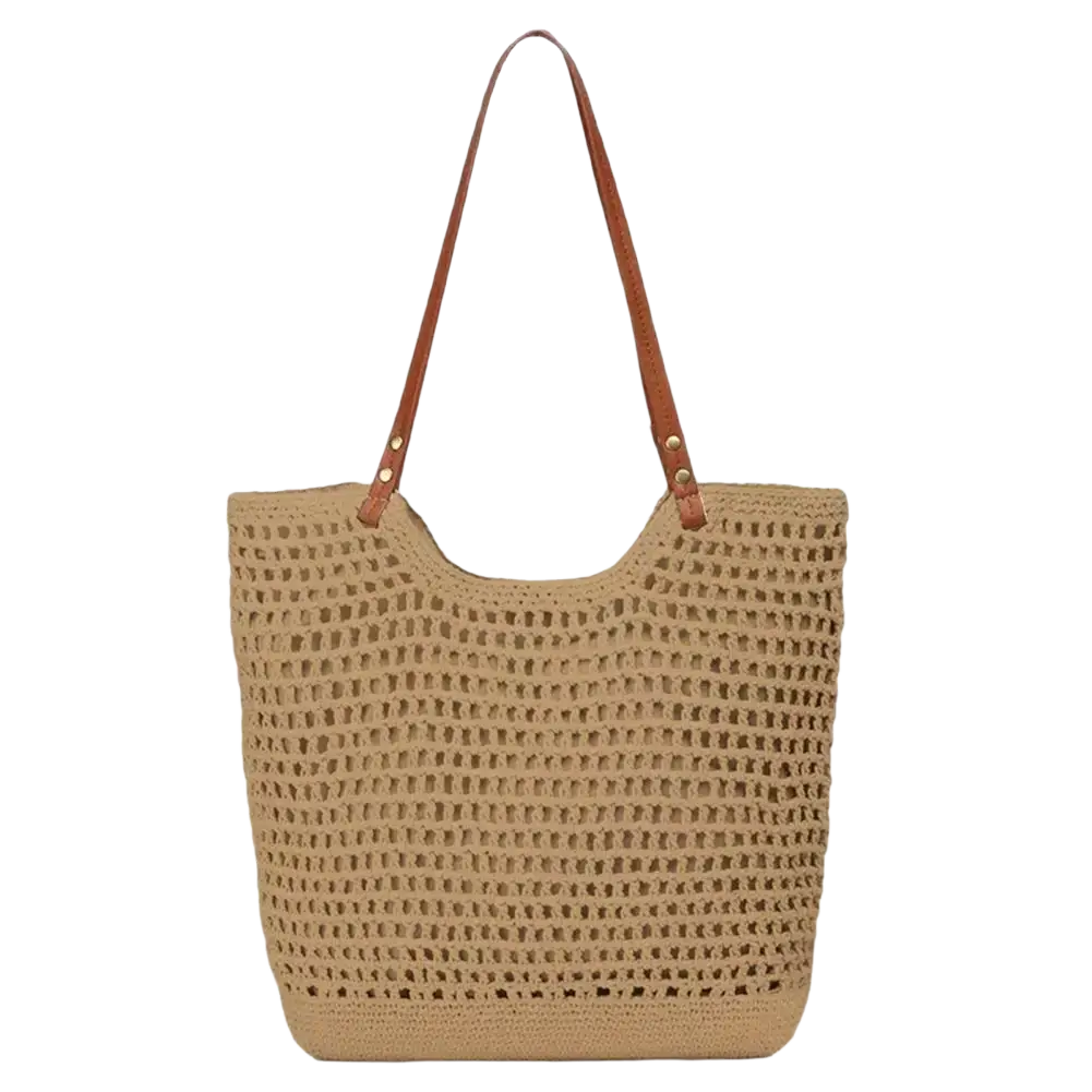 Beige woven straw tote bag with brown leather handles featuring large capacity for summer beach use