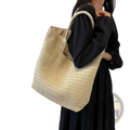 Beige woven straw tote bag with matching handles large vacation handbag for beach and travel use