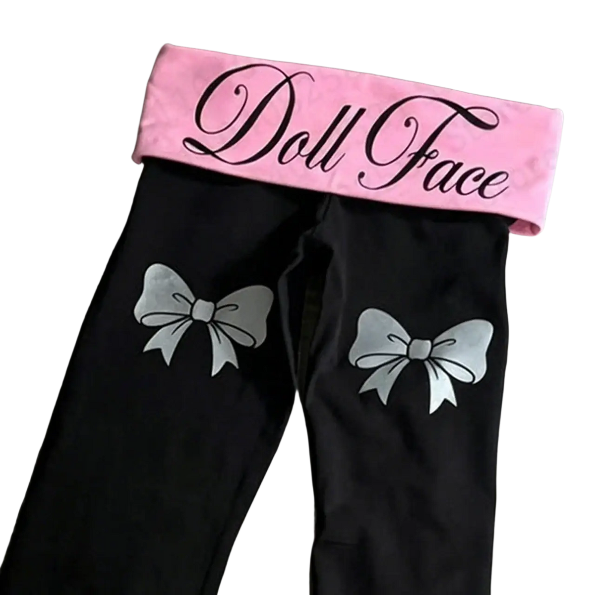 Black y2k flare leggings with silver bow designs and pink elastic waistband featuring doll face logo in black cursive