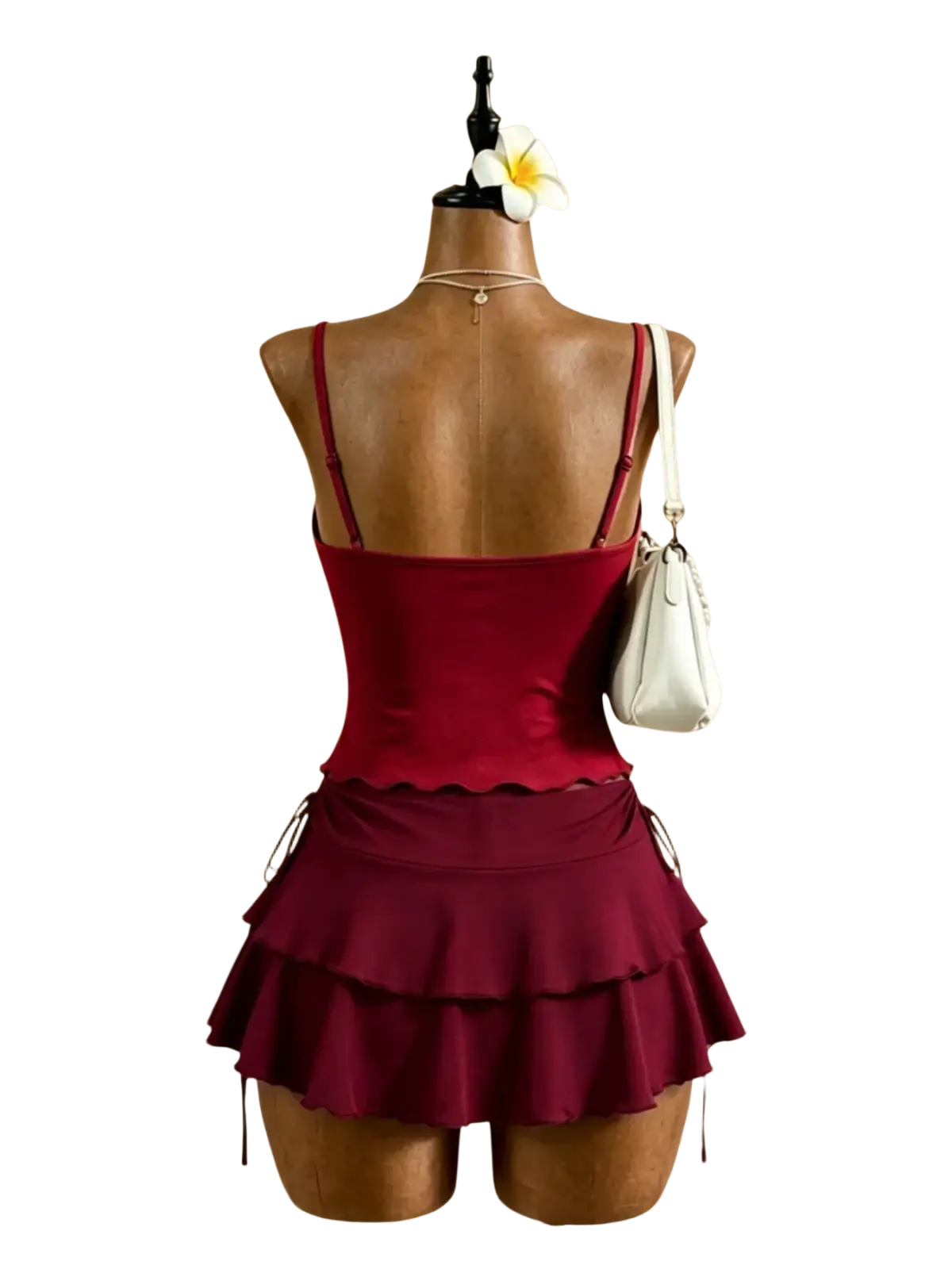A maroon y2k high waist tie two piece swimsuit with a fitted top and tiered ruffle skirt on a mannequin