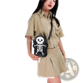Black crossbody shoulder bag with white skeleton skull design on front, featuring y2k style and durable material