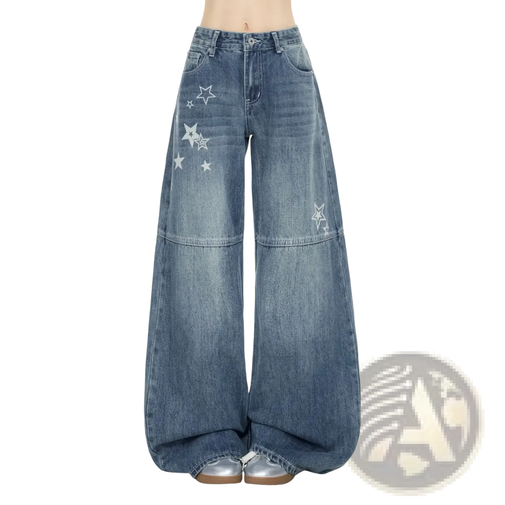 Wide-leg denim jeans in medium-wash blue with white star embroidery on thighs and lower leg y2k style