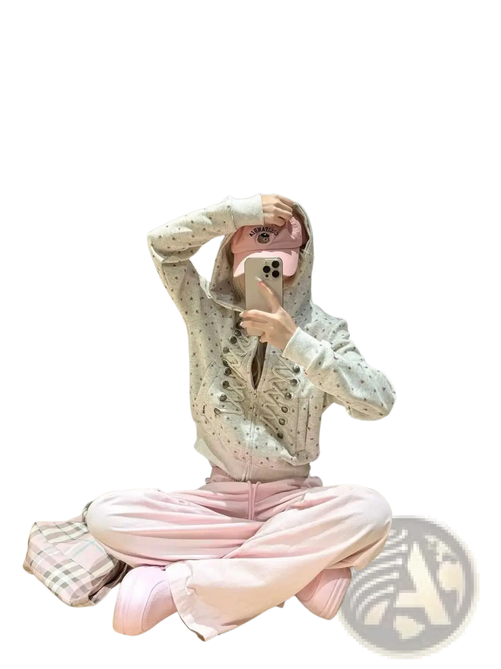A person wearing a white y2k star print lace-up zip hoodie with black polka dots and silver buttons paired with pink sweatpants