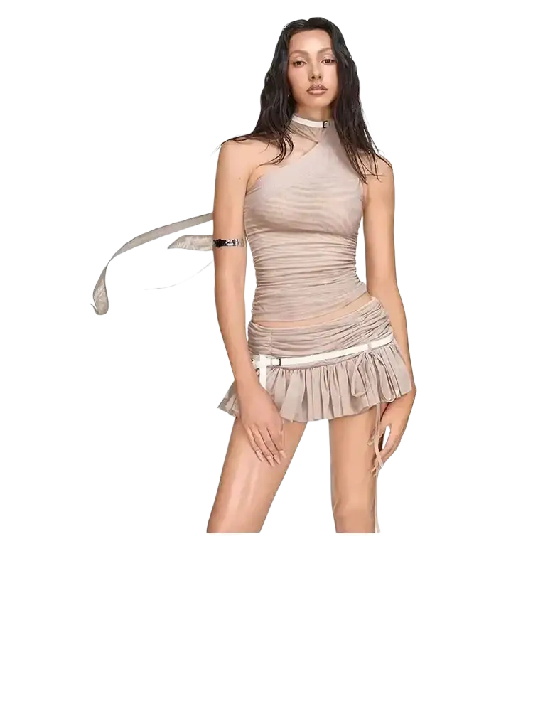 Beige ruched halter top with high neckline and closure type detail paired with fringed mini skirt by yueesoul