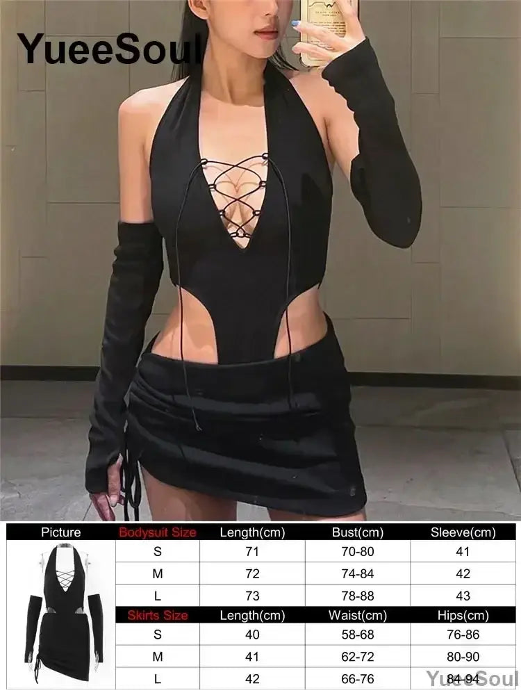 Black halter neck bodysuit with lace up front closure and cut out sides paired with matching long gloves