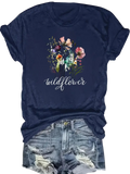 Navy blue y2k short sleeve t-shirt with watercolor wildflower design and white cursive wildflower graphic print
