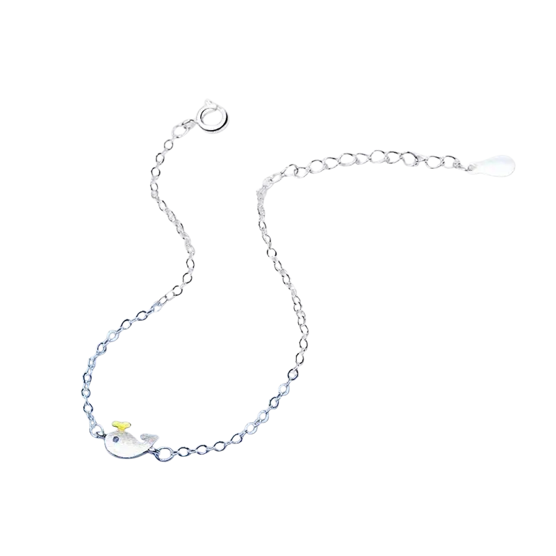 Yaameli sterling silver cubic zirconia whale bracelet with delicate chain links, tiny yellow hat, and teardrop charm